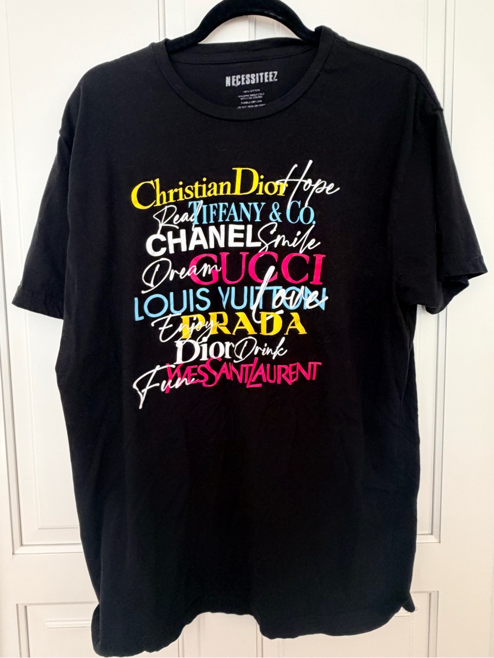 Black Short-Sleeve Graphic Tee with Multicolor Luxury Logo Print
